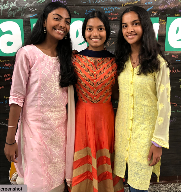 Picture of 3 students dressed in traditional clothing to celebrate Diwali